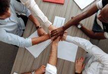 man and woman holding each other s hands as a team