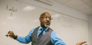 teacher giving out instructions not to cheat
