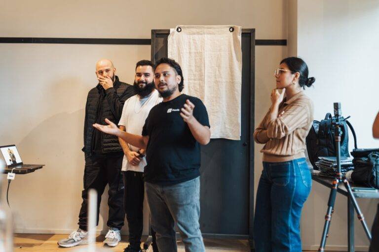 men and woman presenting in meeting in office