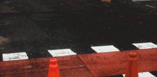 traffic cones next to zebra crossing