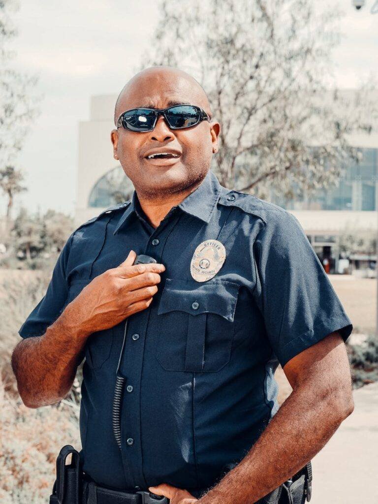 photo of a policeman wearing black sunglasses