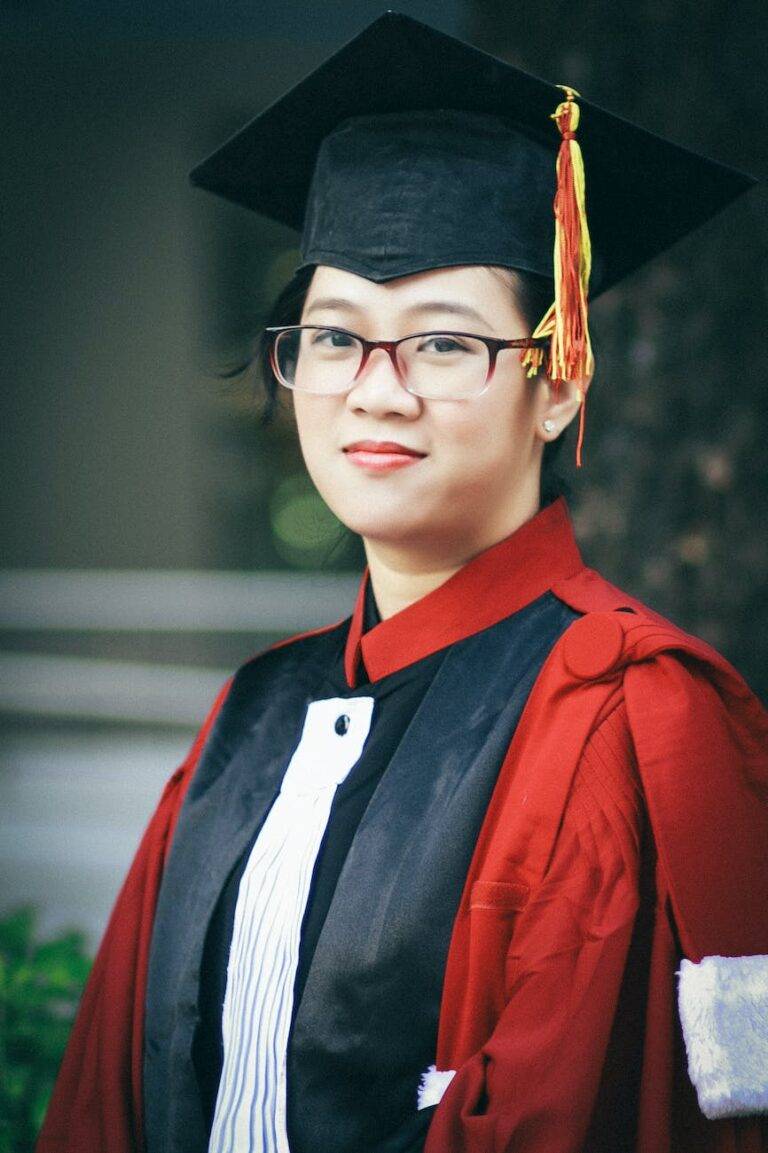 photo of woman wearing academic dress