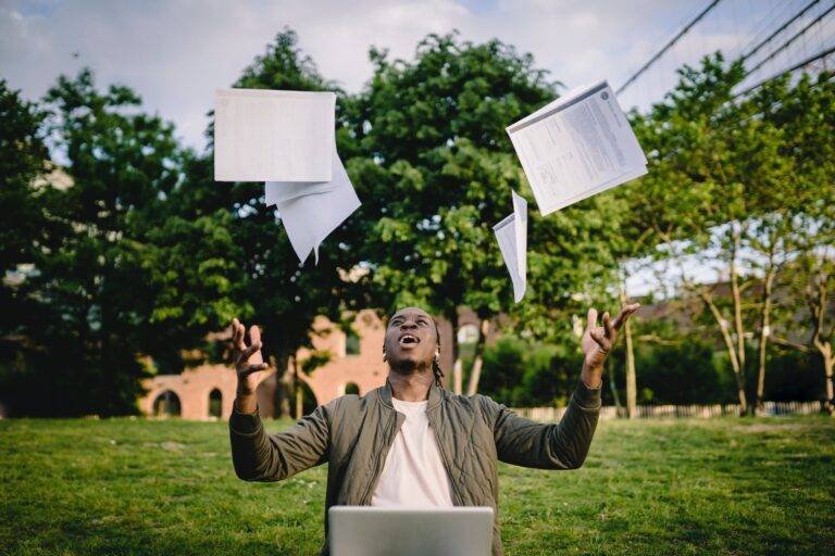 excited african american male student celebrating successful results of exams
