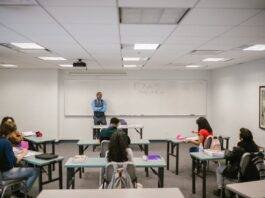 teacher proctoring his students during an examination
