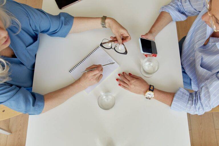 women sitting at table at meeting