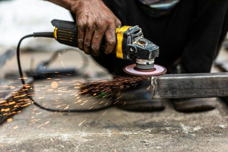 man polishing metal