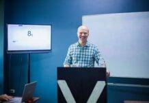 instructor giving a lecture in a lecture room