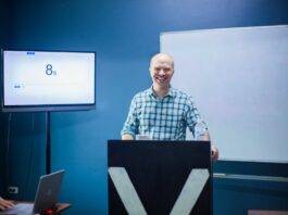 instructor giving a lecture in a lecture room