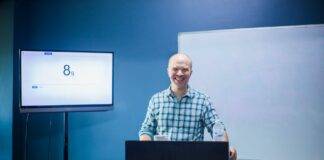instructor giving a lecture in a lecture room