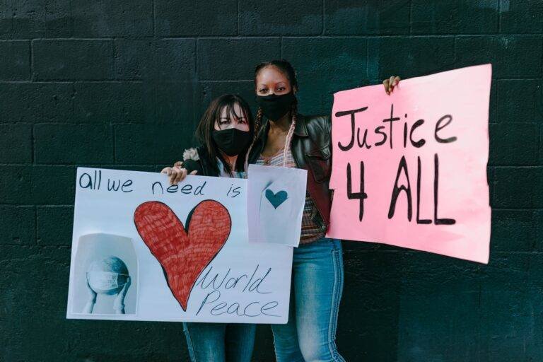 multiracial women with banners on street