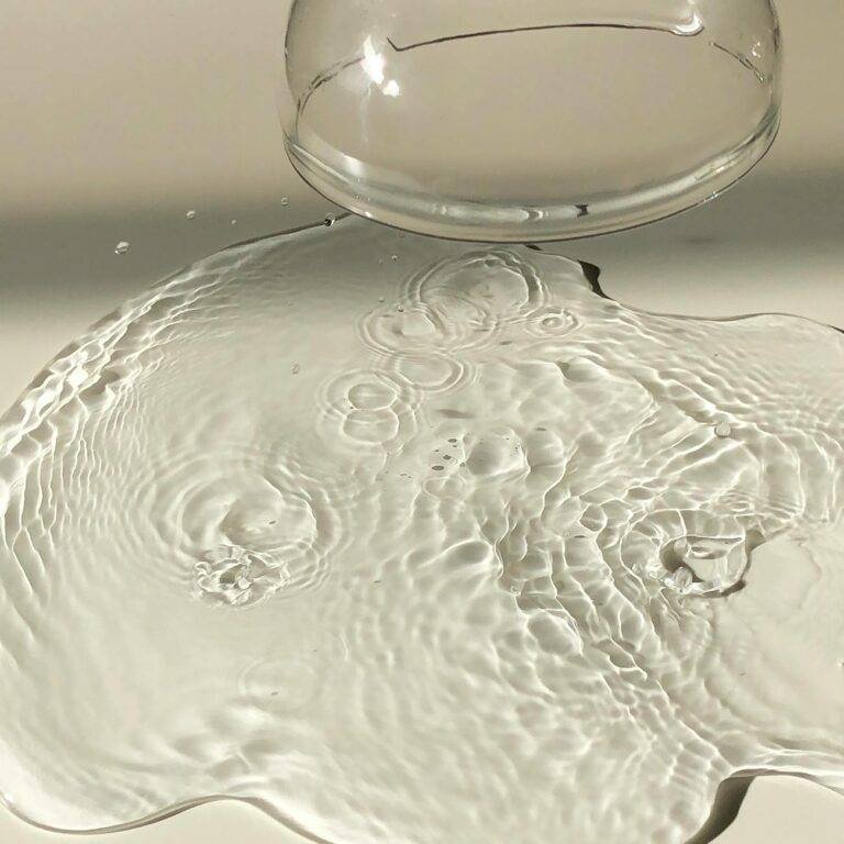 inverted wineglass near spilled water