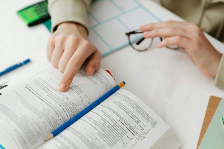 person reading a book and studying