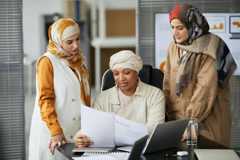 three businesswomen checking on a documents