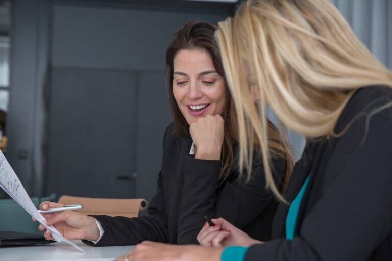working women wearing black blazers