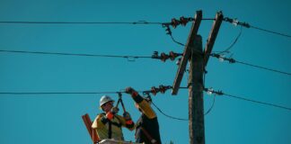electricians fixing the electric lines