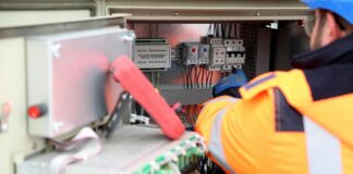 a man maintaining an inverter