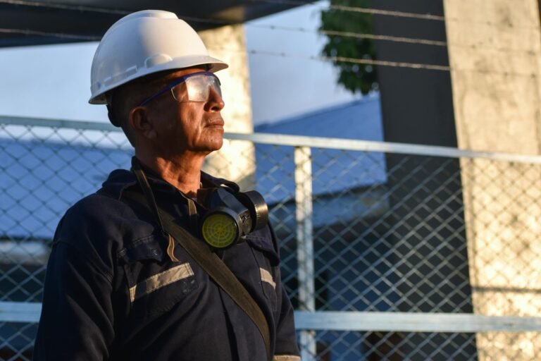 man in safety helmet and goggles