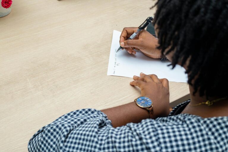 woman writing a note in an office