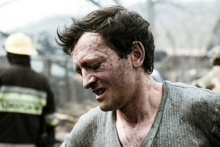 man expressing pain during an incident