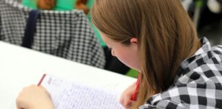 woman writing on paper