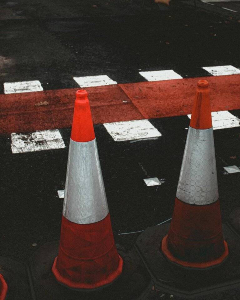 traffic cones next to zebra crossing