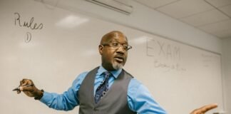 teacher giving out instructions not to cheat