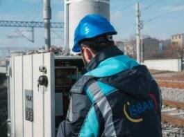 an electrician inspecting a fuse box