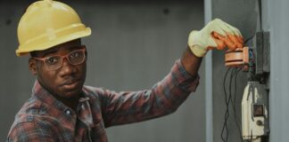 an electrician repairing a fuse box