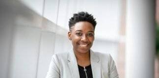 woman wearing gray notch lapel suit jacket