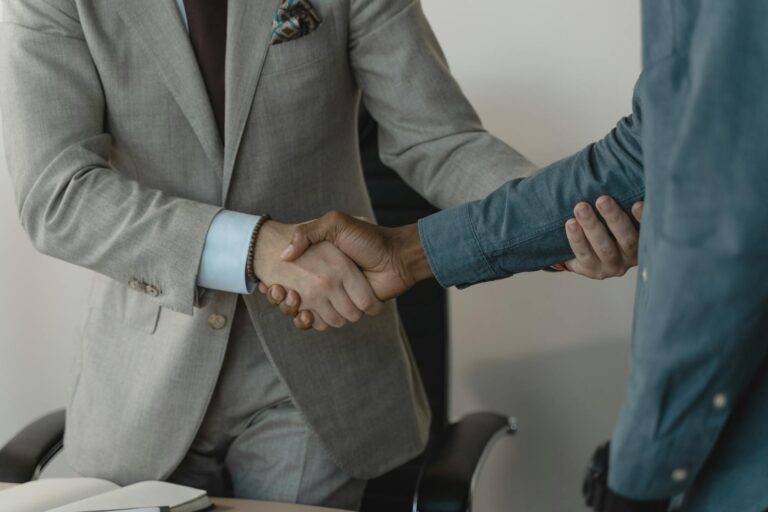 photo of people doing handshake