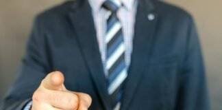 man wearing a suit jacket and stripe necktie