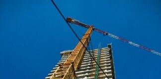 industrial crane near constructed building