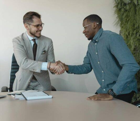 man in blue long sleeve shirt gets the job