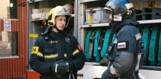 firefighters having a conversation while standing