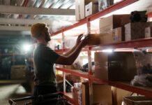 person pulling box from a shelf