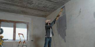 man painting the wall