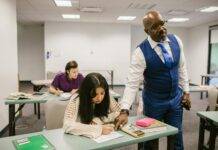 teacher proctoring his students during an examination