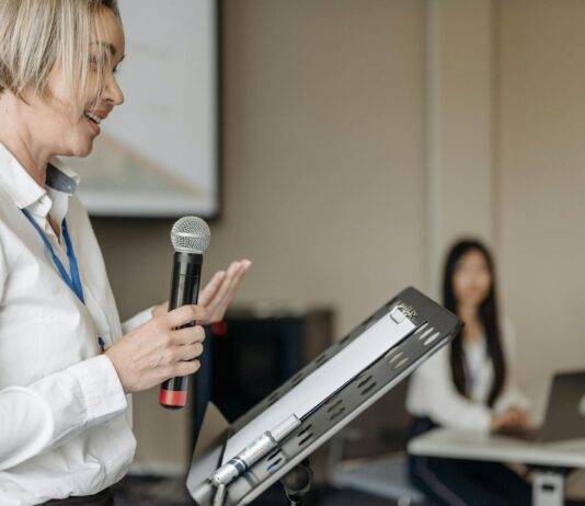 a woman holding a microphone