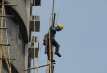 builder working on a scaffolding