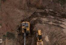 aerial photo of excavator road roller and bulldozer