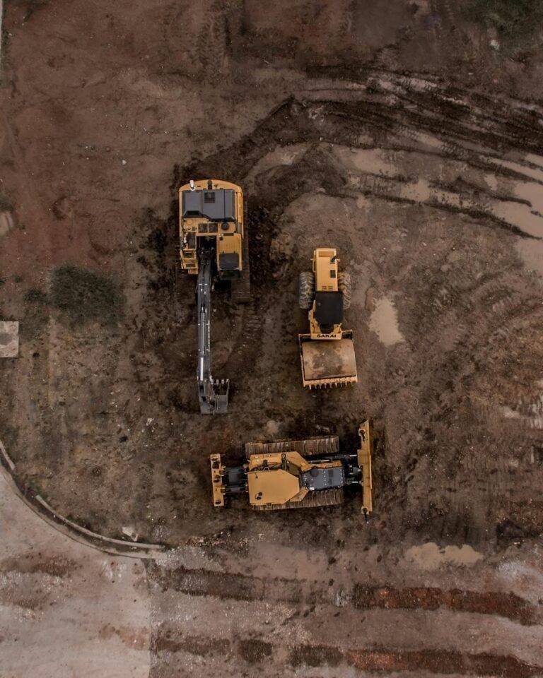 aerial photo of excavator road roller and bulldozer
