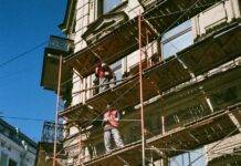 men on brown scaffolding