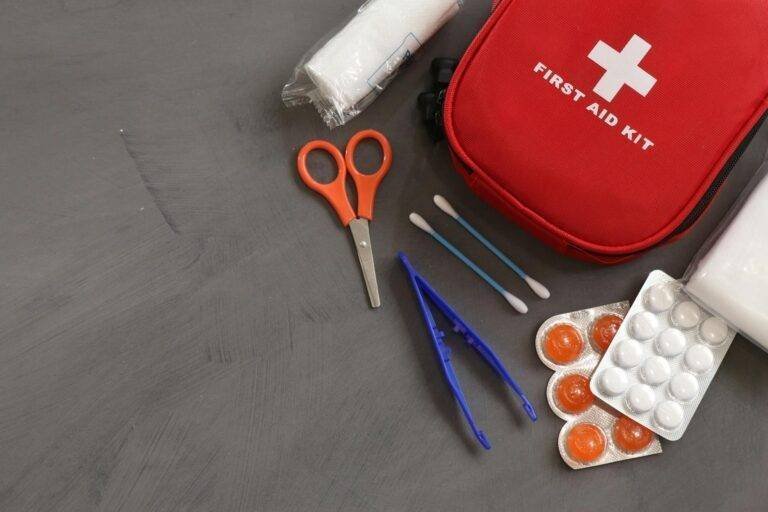first aid kit on gray background