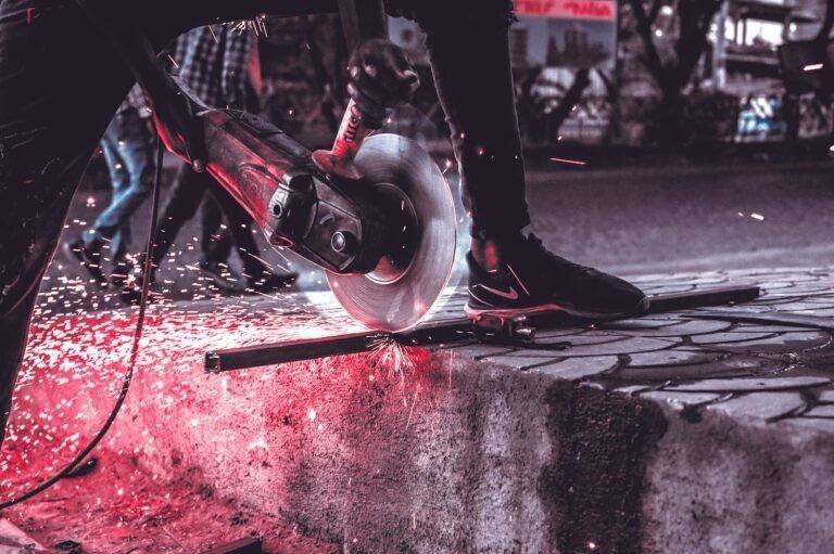 a person cutting the metal
