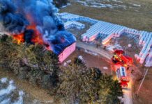 drone shot of a building on fire