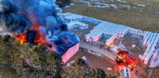 drone shot of a building on fire