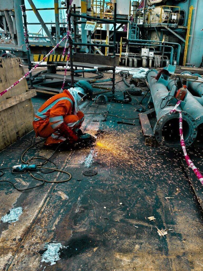 industrial worker welding on offshore rig