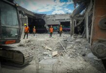 construction workers at demolition site