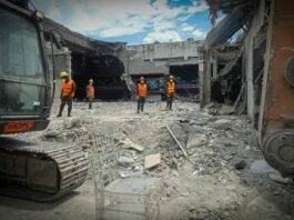 construction workers at demolition site