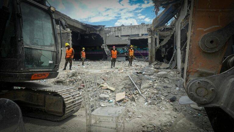 construction workers at demolition site